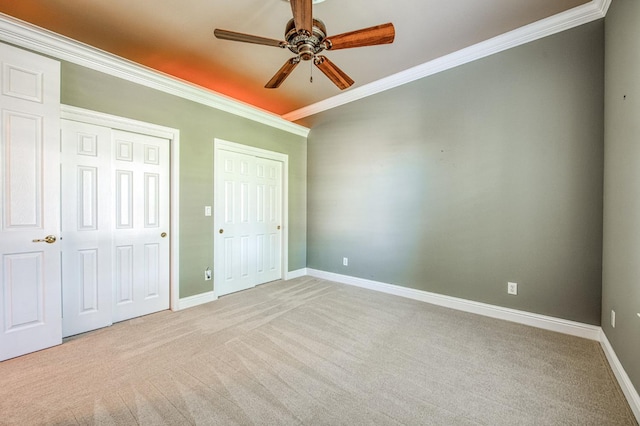 1643 E Shadow Glen Dr, Fresno, CA 93730 - unfurnished bedroom with carpet floors, baseboards, multiple closets, and ornamental molding