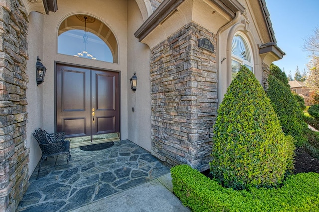 1643 E Shadow Glen Dr, Fresno, CA 93730 - view of exterior entry with stone siding and stucco siding