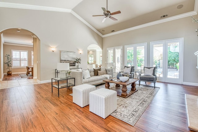 1643 E Shadow Glen Dr, Fresno, CA 93730 - living area with light wood-style floors, arched walkways, a ceiling fan, baseboards, and visible vents