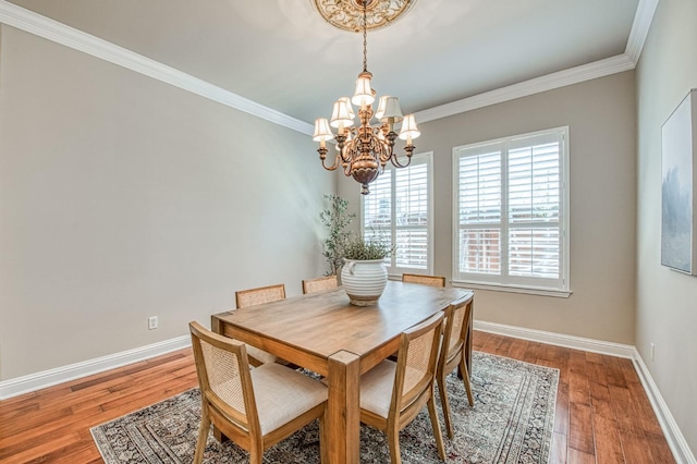 1643 E Shadow Glen Dr, Fresno, CA 93730 - dining area with baseboards, a notable chandelier, ornamental molding, and wood finished floors