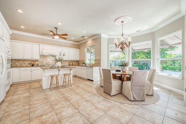 1643 E Shadow Glen Dr, Fresno, CA 93730 - interior space featuring light tile patterned floors, ornamental molding, ceiling fan with notable chandelier, and recessed lighting