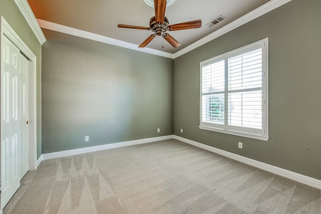 1643 E Shadow Glen Dr, Fresno, CA 93730 - spare room with a ceiling fan, visible vents, carpet floors, baseboards, and ornamental molding