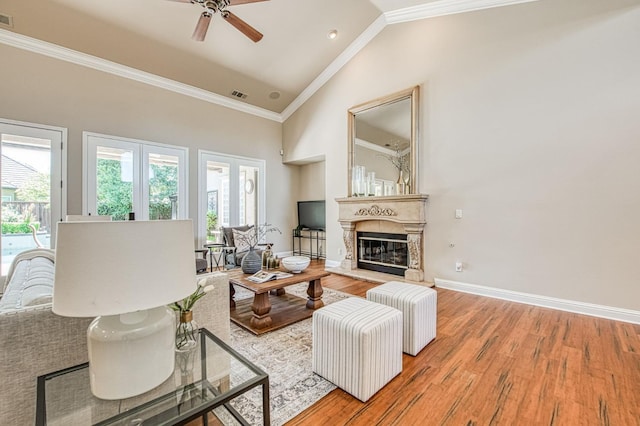 1643 E Shadow Glen Dr, Fresno, CA 93730 - living room with a ceiling fan, visible vents, ornamental molding, and a healthy amount of sunlight