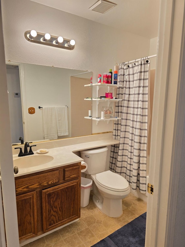 1295 E Athens Ave, Fresno, CA 93720 - bathroom featuring toilet, vanity, and a shower with shower curtain