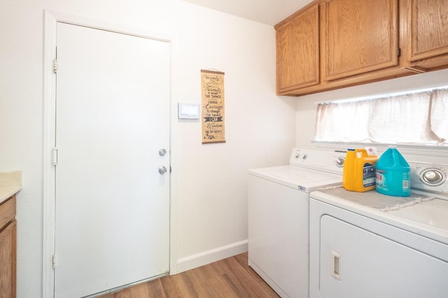 1295 E Athens Ave, Fresno, CA 93720 - clothes washing area featuring washing machine and dryer, cabinet space, light wood-style flooring, and baseboards