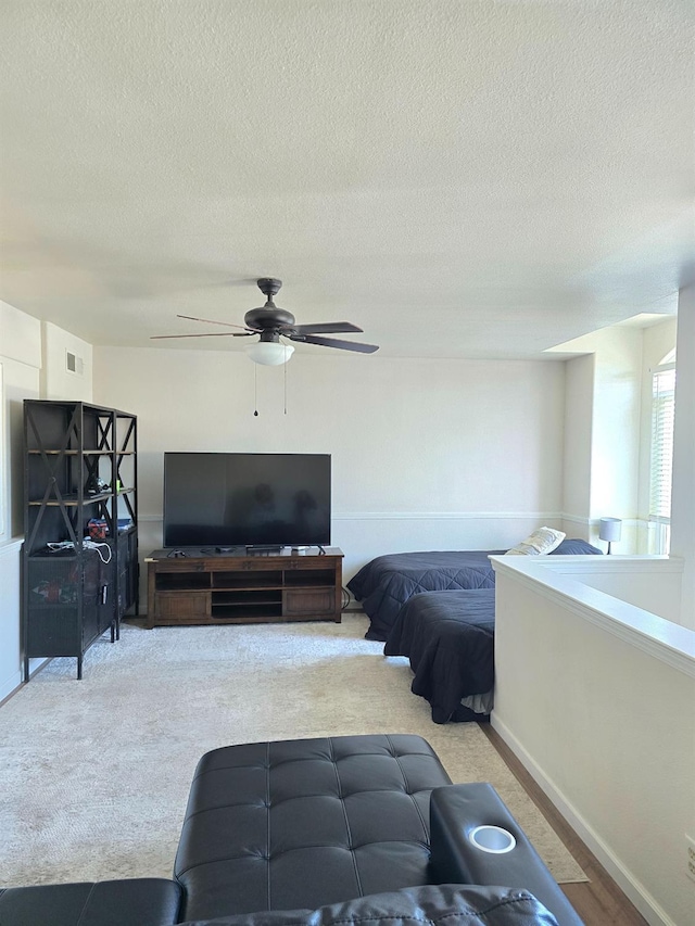 1295 E Athens Ave, Fresno, CA 93720 - carpeted bedroom featuring a textured ceiling, a ceiling fan, and baseboards
