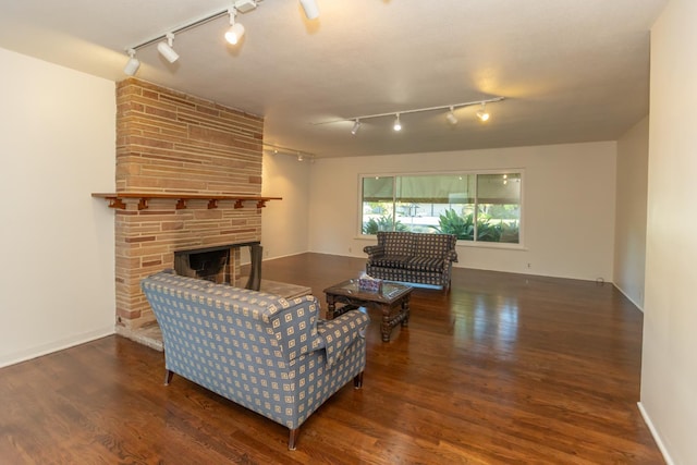 1436 W Keats Ave, Fresno, CA 93711 - living area with track lighting, wood finished floors, and a stone fireplace