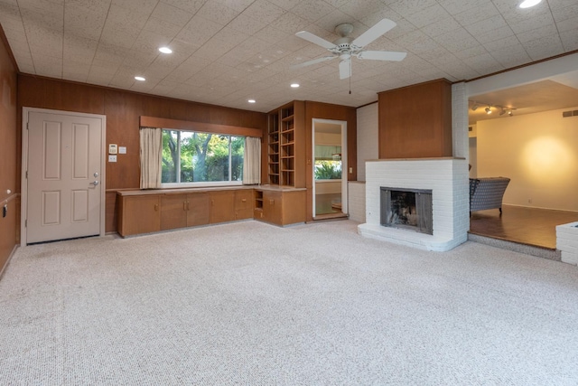 1436 W Keats Ave, Fresno, CA 93711 - unfurnished living room featuring a fireplace, recessed lighting, a ceiling fan, carpet floors, and wood walls