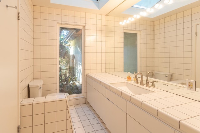 1436 W Keats Ave, Fresno, CA 93711 - bathroom featuring tile walls, tile patterned floors, and vanity
