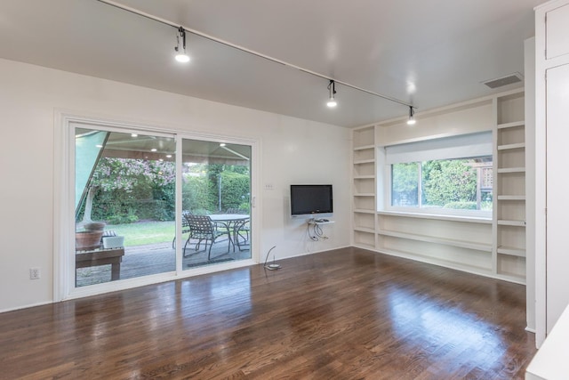 1436 W Keats Ave, Fresno, CA 93711 - unfurnished living room with built in features, wood finished floors, healthy amount of natural light, and rail lighting