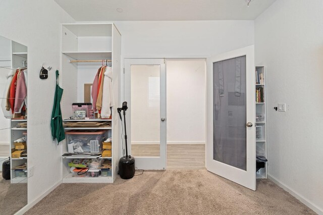 carpeted bedroom with baseboards