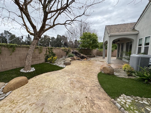 11 W Serena Ave, Clovis, CA 93619 - fenced backyard with central AC unit, a ceiling fan, and a patio area