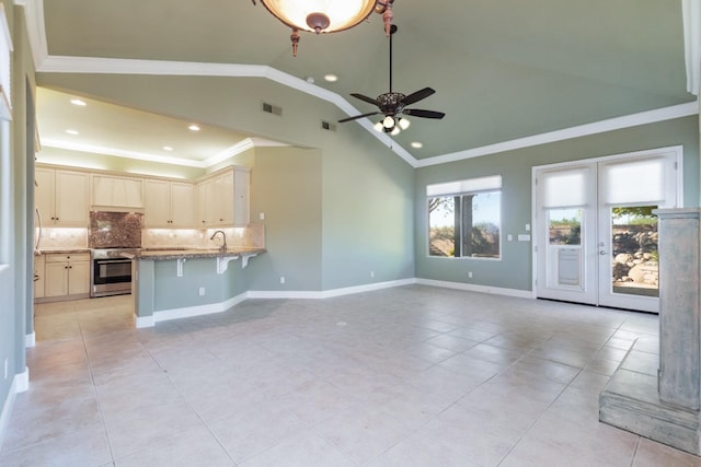 11 W Serena Ave, Clovis, CA 93619 - unfurnished living room featuring a ceiling fan, ornamental molding, light tile patterned flooring, a sink, and recessed lighting