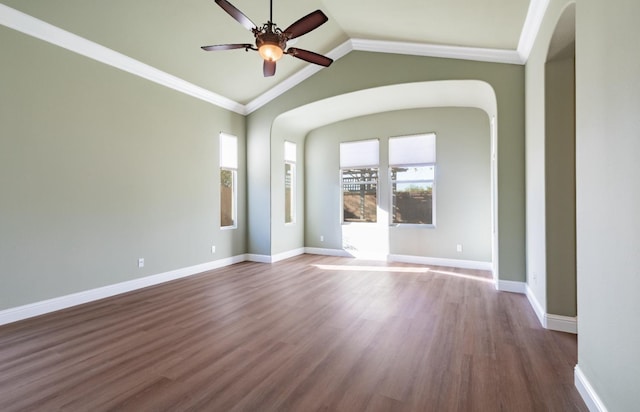 11 W Serena Ave, Clovis, CA 93619 - spare room featuring a ceiling fan, dark wood-style flooring, vaulted ceiling, ornamental molding, and arched walkways
