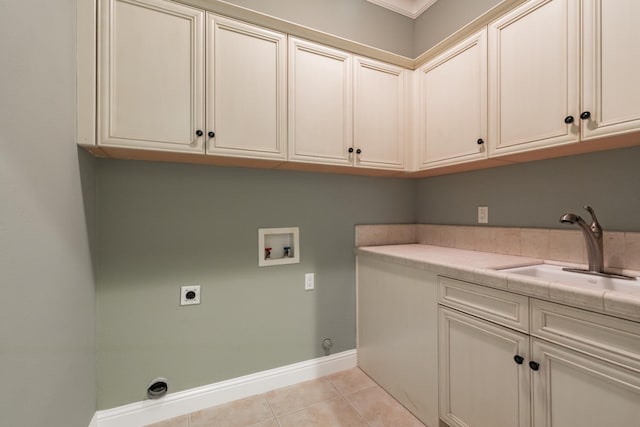 11 W Serena Ave, Clovis, CA 93619 - clothes washing area featuring electric dryer hookup, cabinet space, hookup for a washing machine, light tile patterned floors, and baseboards