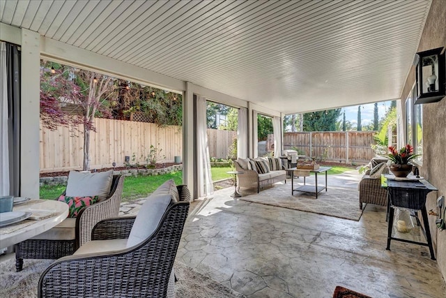 sunroom / solarium featuring an outdoor living space