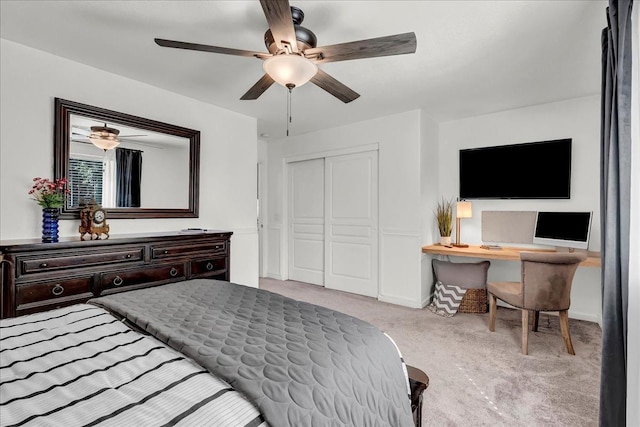 carpeted bedroom featuring a closet and a ceiling fan