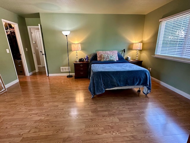 2589 W Barstow Ave, Fresno, CA 93711 - bedroom featuring wood finished floors and baseboards