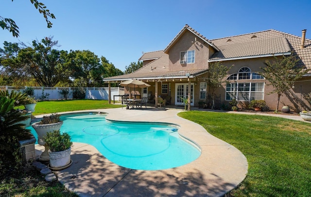 view of pool featuring a fenced in pool, a fenced backyard, french doors, a yard, and a patio area