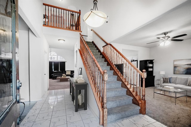 stairs with marble finish floor and ceiling fan