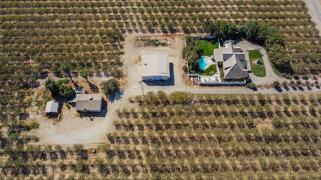 birds eye view of property with a rural view