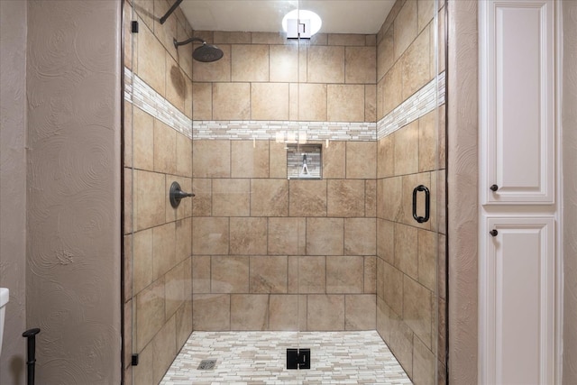 full bathroom featuring a shower stall