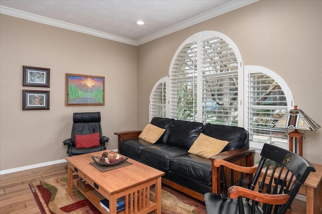 living room with baseboards, ornamental molding, recessed lighting, and wood finished floors