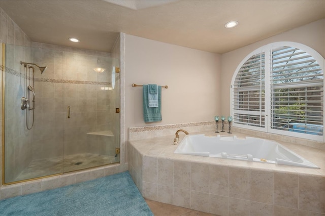full bathroom with a garden tub, tile patterned floors, a stall shower, and recessed lighting
