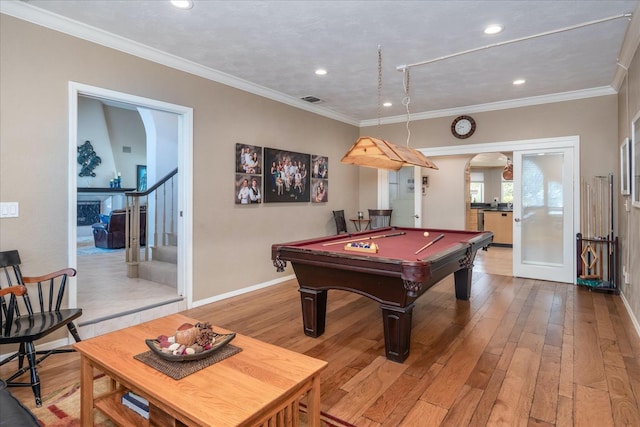 game room featuring arched walkways, light wood-style flooring, billiards, and visible vents