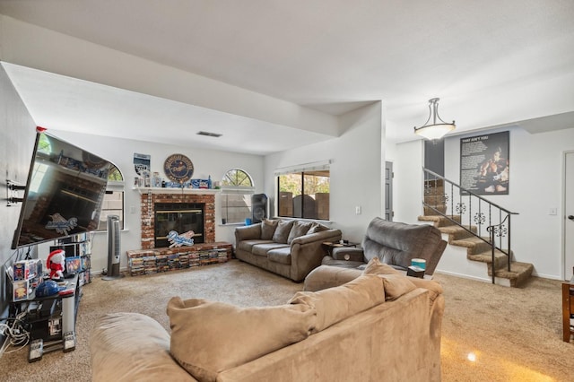 100 Rosewood Cir, Madera, CA 93637 - living room with stairs, carpet floors, a brick fireplace, baseboards, and visible vents