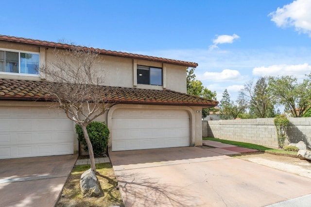 100 Rosewood Cir, Madera, CA 93637 - garage featuring fence and concrete driveway