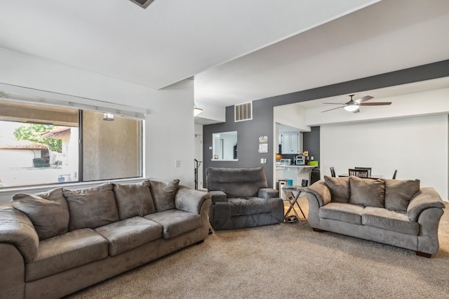100 Rosewood Cir, Madera, CA 93637 - carpeted living area with visible vents and a ceiling fan