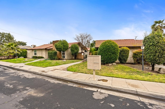 1063 Pierce Dr, Clovis, CA 93612 - view of front of house featuring a tile roof and a front yard
