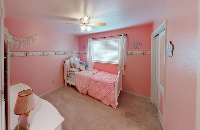 7186 N Gregory Ave, Fresno, CA 93722 - bedroom featuring light colored carpet, ceiling fan, baseboards, and a closet