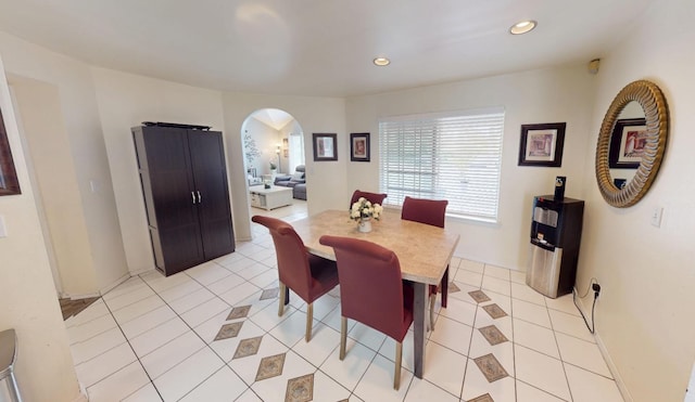 7186 N Gregory Ave, Fresno, CA 93722 - dining space featuring arched walkways, light tile patterned flooring, recessed lighting, and baseboards