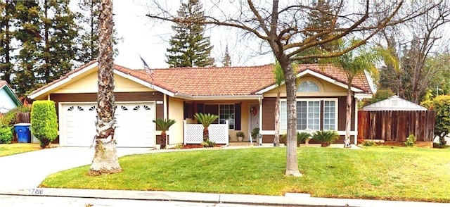 7186 N Gregory Ave, Fresno, CA 93722 - ranch-style house featuring a garage, concrete driveway, a tiled roof, and stucco siding