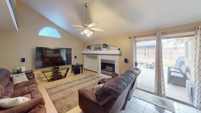 7186 N Gregory Ave, Fresno, CA 93722 - living room featuring a ceiling fan, a fireplace, tile patterned flooring, and high vaulted ceiling