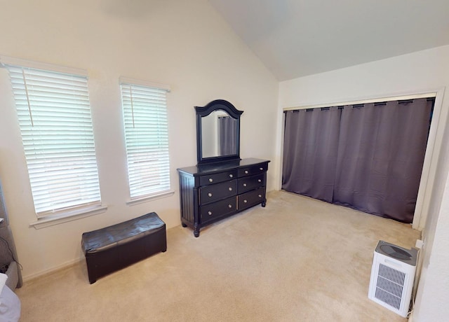 7186 N Gregory Ave, Fresno, CA 93722 - bedroom featuring light carpet and lofted ceiling