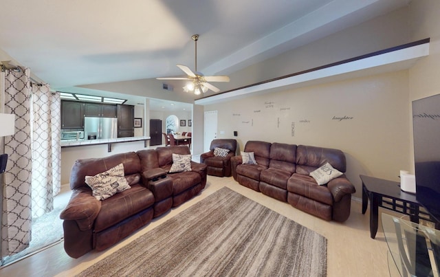 7186 N Gregory Ave, Fresno, CA 93722 - living area featuring vaulted ceiling, light wood-style flooring, and ceiling fan