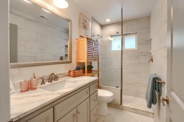 bathroom featuring visible vents, a tile shower, toilet, recessed lighting, and vanity