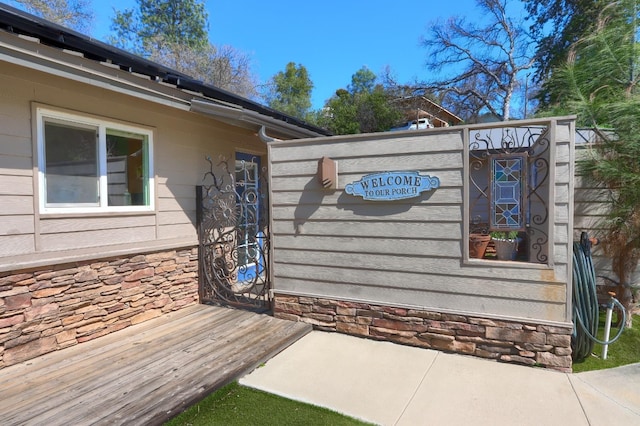 exterior space with stone siding