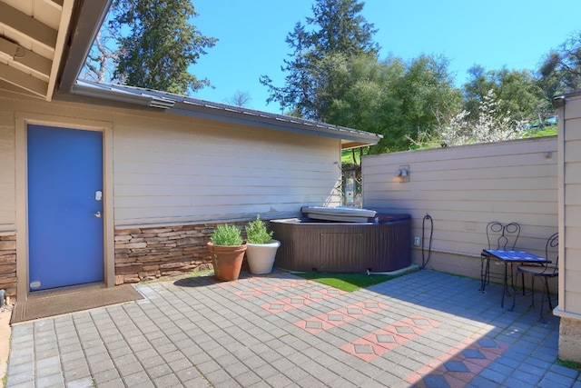 view of patio featuring fence