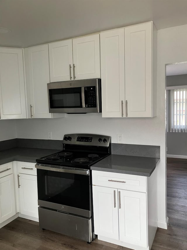 3012 N Fruit, Fresno, CA 93705 - kitchen with appliances with stainless steel finishes, dark countertops, and white cabinets
