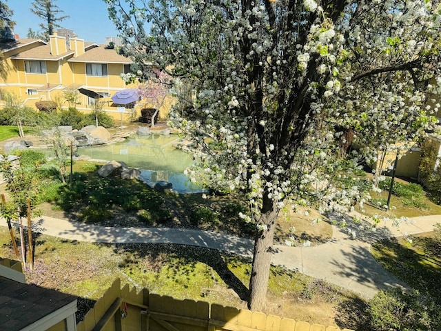 aerial view of property's location featuring a small pond