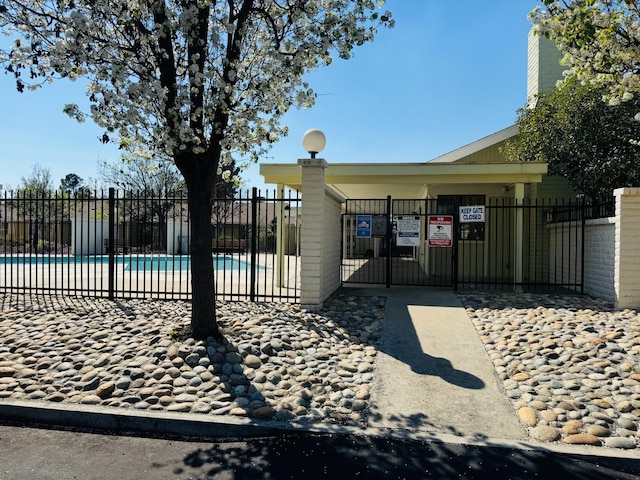 gate with fence and a community pool