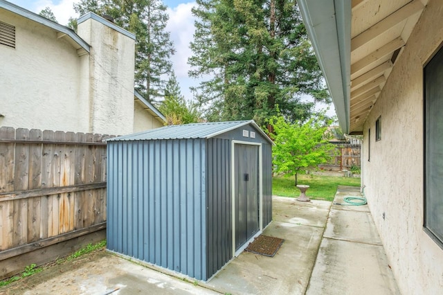 view of shed with a fenced backyard