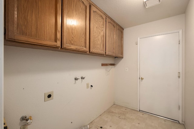 laundry area with light floors, visible vents, hookup for an electric dryer, washer hookup, and cabinet space