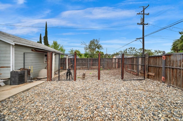 view of yard with a fenced backyard and an outdoor structure