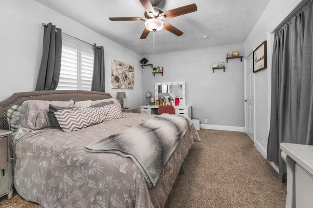 bedroom featuring a ceiling fan, carpet floors, and baseboards
