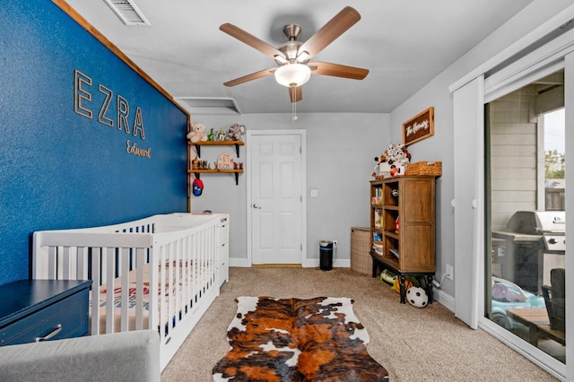 carpeted bedroom with baseboards, ceiling fan, and visible vents